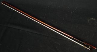 A mother of pearl inlaid violin bow