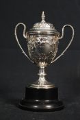 A 1930's rococo hallmarked silver trophy complete with lid being hallmarked for Sheffield 1931 and