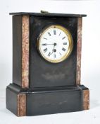 A late Victorian slate and marble mantel clock. Enamel face, brass movement, with key and pendulum.