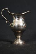 An early 19th century hallmarked silver ewer / jug in the rococo style marked for london with