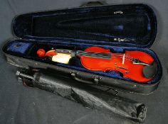 A cased violin by Steven Spence along with a music stand.