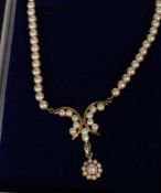 A 9ct gold ladies clasp necklace constructed of simulated pearls complete with pearl pendant of