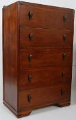 A 1930's art deco oak tall chest of drawers. Original handles to each of the drawers having stub