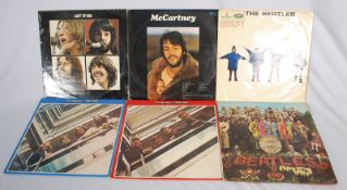 A collection of vinyl Beatles records ( albums )