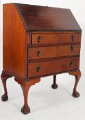 A 1930's Art Deco ball and claw foot mahogany bureau writing desk. Cabriole legs with ball and