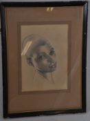 A 20th century pencil sketch portrait of a nubian lady, being mounted, framed and glazed, signed