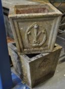 A pair of stone garden planters in square form having wheatsheaf motif to each side