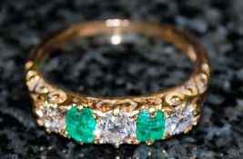 A 5 stone emerald and diamond ring 18k approx 50pts. Size T