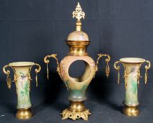 A 1930's China clock garniture.having gilt metal embellishments to the sides. Registration number to