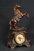 A 20th century spellter mantle clock. The inset face with enamel front set within a spelter body