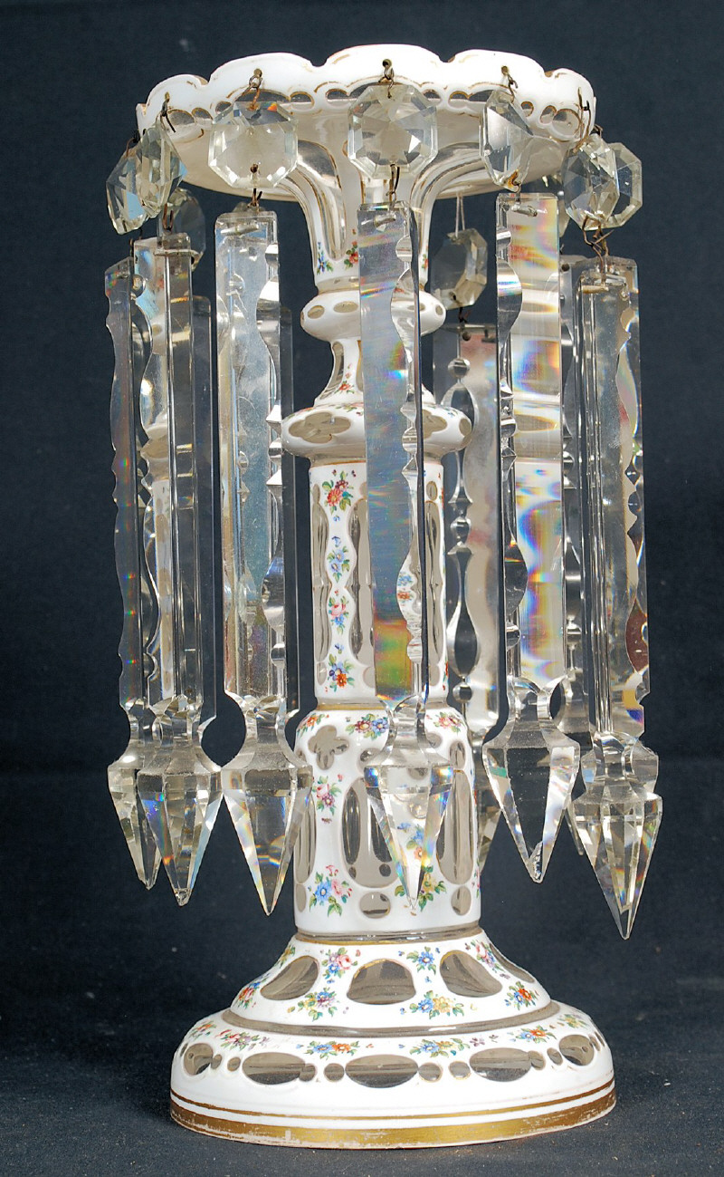 A Victorian large cut glass table Lustre having hanging pendants to the sides. The central column