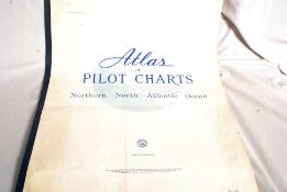 A vintage Atlas Of Pilot Charts (maps) along with some other navigation maps.