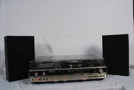 A Sanyo music record player with speakers