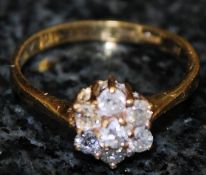 An 18k Daisy diamond ring 50 pts approx. Size X