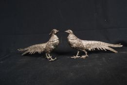 A pair of 20th century silver plated table top pheasants, cock and hen.