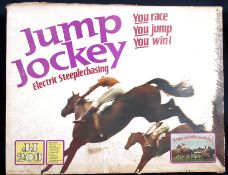 An original Triang electric Jump Jockey Steeplechase game in original box. H40cm x W60cm.