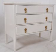 A painted 1930's French style shabby chic chest of drawers. Raised on square legs with 3 drawers,
