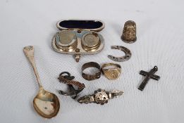 A collection of assorted hallmarked silver items to include hallmarked anchor with HMS Triumph