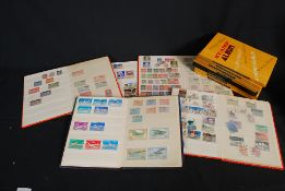 Collection of vintage overseas and UK stamps in albums