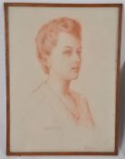 Dorothy Sims Williams - A red chalk painting, notation to verso in a frame. A portrait of seated