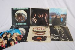 A selection of LP vinyl records by The Rolling Stones, all albums.