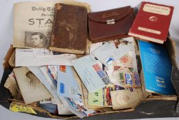 A box of mixed ephemera to include stamps, newspapers, magazines etc