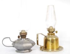 A 19th century Arts & Crafts pewter chamber / nightime oil lamp having saucer and handle base