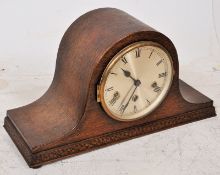 A 1930's Art Deco Napoleons hat mantle clock having Westminster chiming movement. The oak case