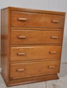 A 1930's Art Deco oak chest of drawers. Splayed bracket plinth base with a bank of drawers above