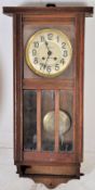 An early 20th century Fears of Bristol bridge 8 day wall clock set within oak case having glass