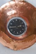 An unusual 1930's car clock having been set into a 19th century copper bed pan