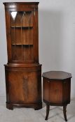 A Regency style mahogany corner cabinet together with an octagonal drinks cabinet having leather