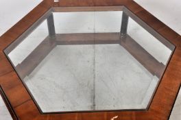 A large empire style octagonal glass coffee table originally retailed by Harrods. The ebonised