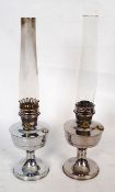 A pair of vintage chrome Aladdin '23' oil lamps, with glass flues. 30cm tall.