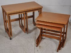 2 sets of 1970's teak nest of tables. One with foldover table top. the other graduating in size on
