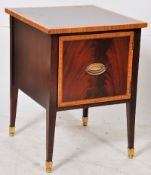 A Georgian style mahogany inlaid bedside cabinet raised on square tapered legs with inlaid details