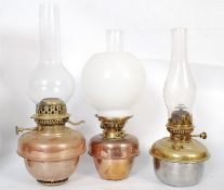 A set of 3 Victorian copper and brass oil lamps ( Standard lamp fitment) Two with bulbous chimneys