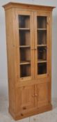 A large 20th century country pine dresser  cabinet. The plinth base with upright body having a