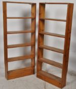 2 20th century large pine bookshelves. The sectioned shelves set fixed to upright supports, the