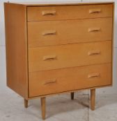 A 1960's retro oak G Plan style chest of drawers. Raised on turned legs with a chest of 4 drawers