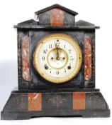 A Victorian slate and marble mantle clock.Enamel face with open escapement centre having rouge