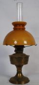 A Victorian Aladdin 23 brass oil lamp. The circular terraced base of stepped form having a bulbous