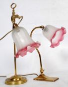A pair of Christopher Wray of London antique style desk lamps. Made of brass complete with frosted