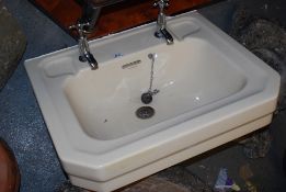 A vintage mid 20th century porcelain wash basin / sink by Twyford.
