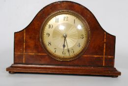 A French  1930's mahogany inlaid open escapement 8 day mantle clock. The small clock with sunburst