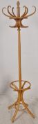 A Thonet style bentwood hat / coat stand stoon on splayed legs with hooks atop