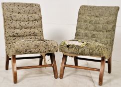 2 retro low 1950's low nursing chairs in the Danish style. Splayed legs with shaped upholstered