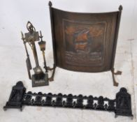A good fireside brass companion set  in the neo classical style together with a cast iron fender and