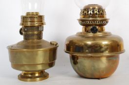 2  Victorian brass oil lamps ( Standard lamp fitment) Both having bulbous reservoirs being free