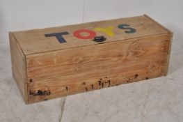 A mid 20th century childrens large pine toy box. The pine wide body having lined interior with